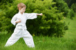 Foto: Little boy make karate exercises Little boy make karate exercises