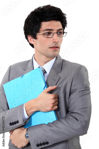 Foto: Businessman holding a folder Businessman holding a folder