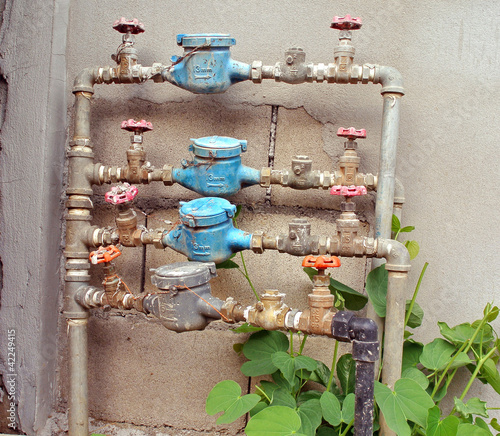 Photo: old rusty water pipe, meter and valve old rusty water pipe, meter and valve