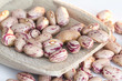 Photo: Beans on wooden spoon and white background Beans on wooden spoon and white background