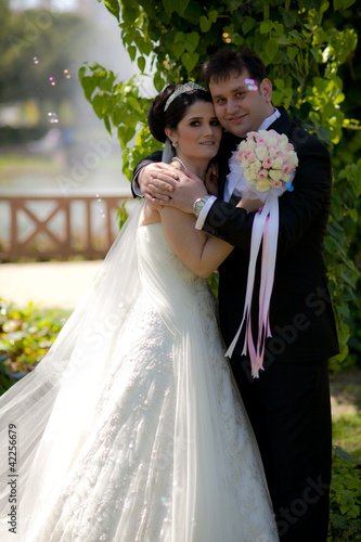 Photo: bride and groom at a park bride and groom at a park