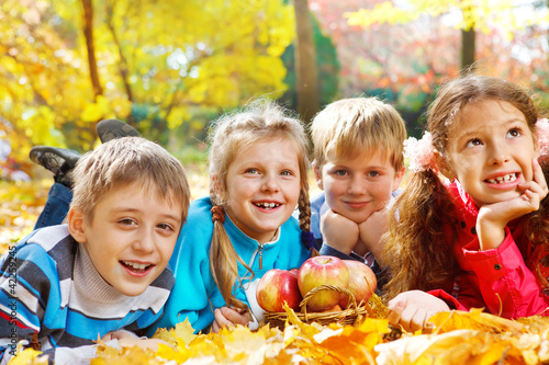 Photo: Kids group in autumn park Kids group in autumn park