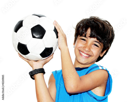 Photo: Cute boy playing football Cute boy playing football