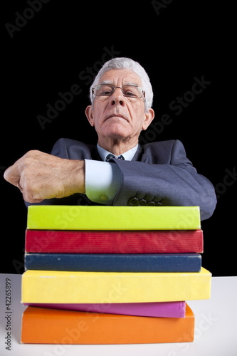 Photo: Senior teacher reading Books Senior teacher reading Books