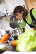 Woman preparing food at the kitchen