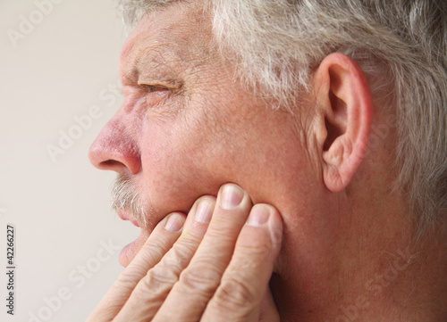 Photo: man with tooth or jaw pain man with tooth or jaw pain