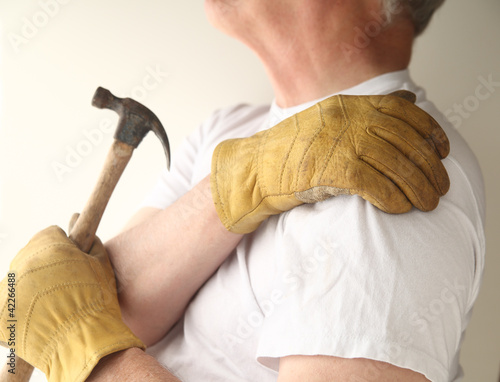Photo: trying to do home maintenance with shoulder pain trying to do home maintenance with shoulder pain