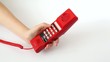 Video: Woman is pressing the buttons of old orange telephone Woman is pressing the buttons of old orange telephone