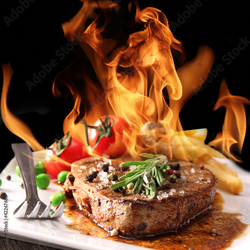  Grilled meat with fire flames