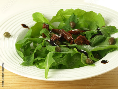 Photo: Arugula with sun dried tomatoes Arugula with sun dried tomatoes