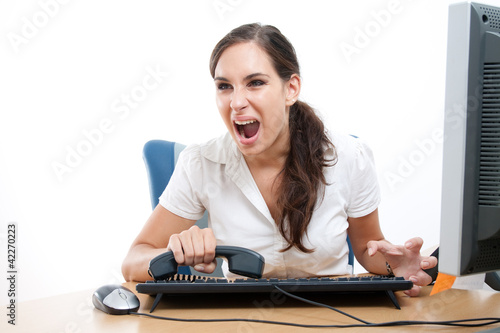 Photo: Businesswoman received bad news over the phone and is screaming Businesswoman received bad news over the phone and is screaming