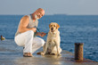 Middle-aged man with labrador dog