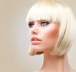 Haircut. Beautiful Girl with Healthy Short Blond Hair. Hairstyle