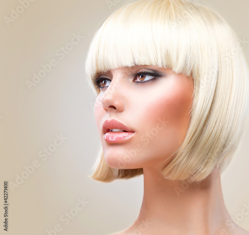 Photo: Haircut. Beautiful Girl with Healthy Short Blond Hair. Hairstyle Haircut. Beautiful Girl with Healthy Short Blond Hair. Hairstyle