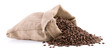 Burlap sack full of coffee beans isolated on white