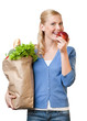 Photo: Pretty woman with a paper bag full of healthy food Pretty woman with a paper bag full of healthy food