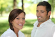 Man contemplating brown-haired woman