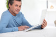 Man with computer inclined