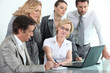 Businessteam around a laptop