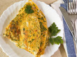 Photo: Scrambled eggs with herbs. Omelet on white plate Scrambled eggs with herbs. Omelet on white plate