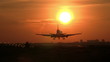 Big plane landing at sunrise