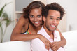 African couple relaxing at home