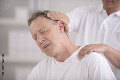 Photo: Chiropractic: Chiropractor doing neck adjustment Chiropractic: Chiropractor doing neck adjustment