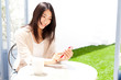 a young asian woman relaxing in the cafe