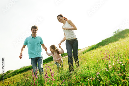 Photo: happy family having fun outdoors happy family having fun outdoors