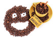 Composition of the cup with coffee beans and smile isolated