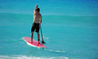 Photo: Man paddling out on paddle board Man paddling out on paddle board