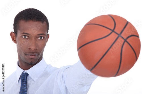 Photo: Man holding basketball Man holding basketball