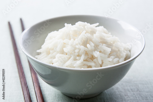 Photo: Long grain rice bowl with chopsticks Long grain rice bowl with chopsticks