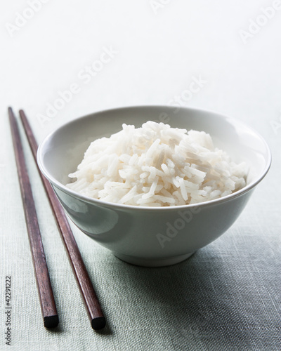 Photo: Long grain rice bowl with chopsticks Long grain rice bowl with chopsticks