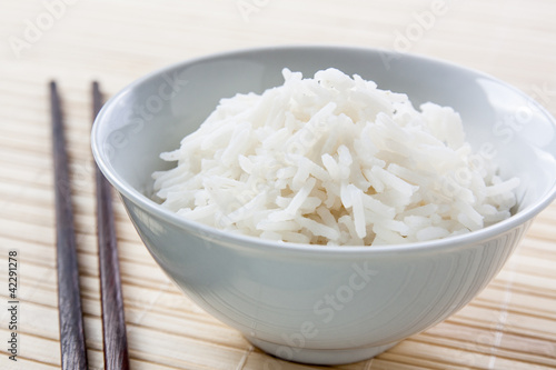 Photo: Long grain rice bowl with chopsticks Long grain rice bowl with chopsticks