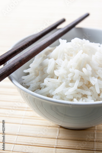 Photo: Long grain rice bowl with chopsticks Long grain rice bowl with chopsticks
