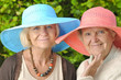 Happy women in hats.