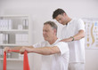 Physiotherapy: Senior man and physiotherapist