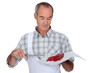 Butcher holding red meat