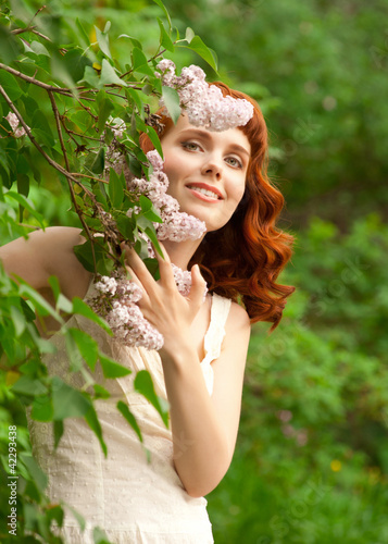 Photo: Woman in summer garden Woman in summer garden