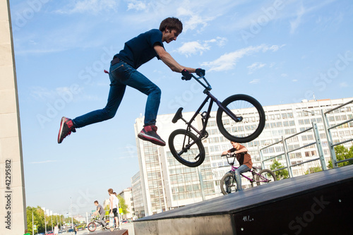 Photo: BMX bicycler over ramp BMX bicycler over ramp
