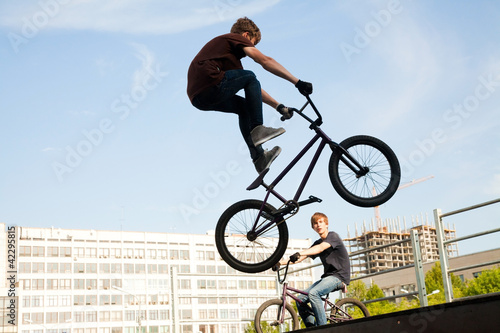Photo: BMX bicycler over ramp BMX bicycler over ramp