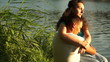 Couple in lover young adult near the water