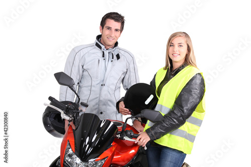 Foto: portrait of young people with motorbike portrait of young people with motorbike