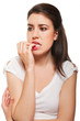Young female biting her nails