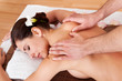 Beautiful young woman getting back massage