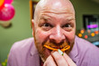 funny man stuffing his face