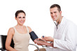 Doctor checking blood pressure
