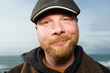 Friendly Irish Man with a red beard and a duck bill cap