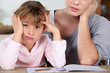 Foto: Little girl bored of her homework Little girl bored of her homework